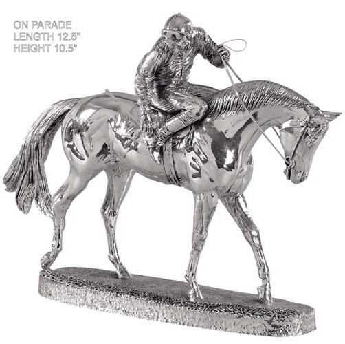 silver figure of a race horse on parade