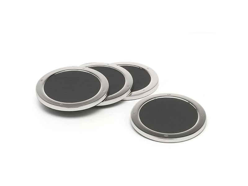 a set of four hallmarked sterling silver drink mats with slate bases