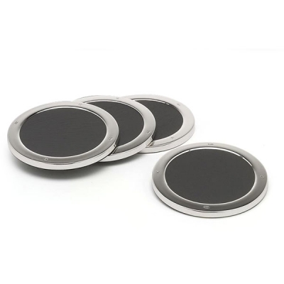 a set of four hallmarked sterling silver drink mats with slate bases