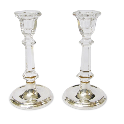 a pair of sterling hallmarked silver footed glass candlesticks